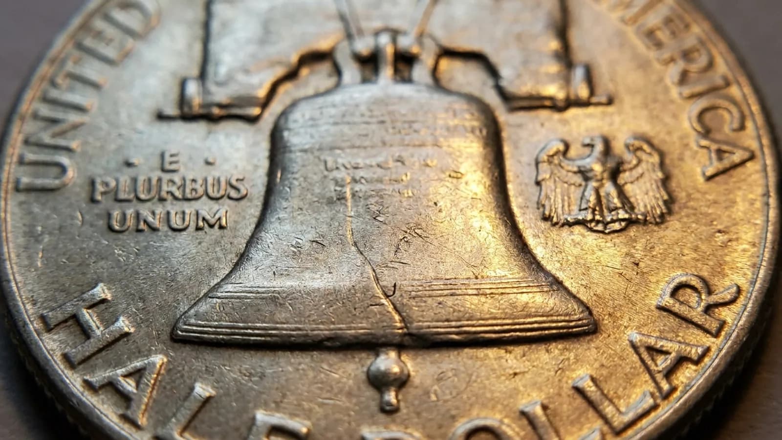 Close view of the Liberty Bell on a Franklin half showing Full Bell Lines