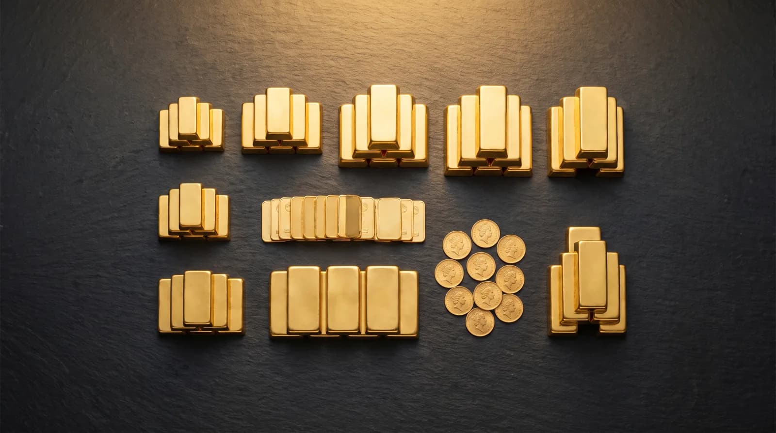 Assorted gold bullion bars and sovereign coins arranged on a dark surface