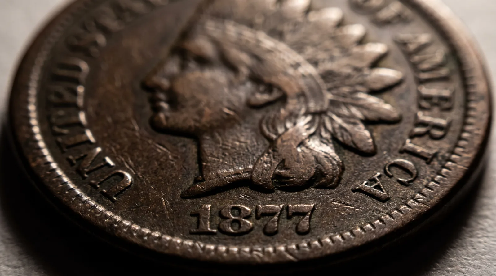 A worn 1877 Indian Head cent, the famous key date of the series