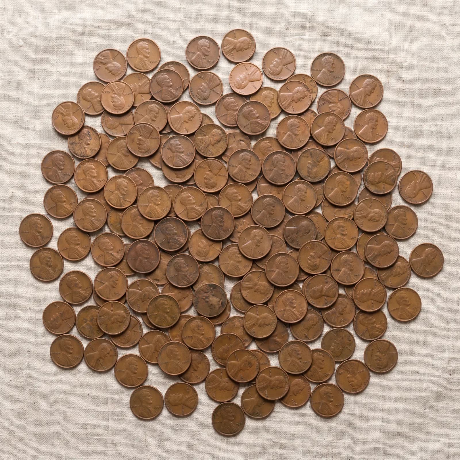 A handful of common Lincoln wheat cents showing the wheat-stalk reverse