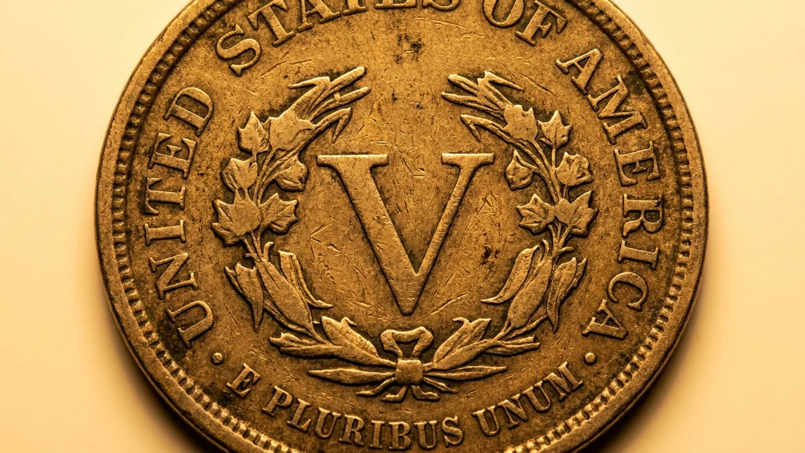 An 1883 Liberty Head nickel reverse showing the large V without the word CENTS