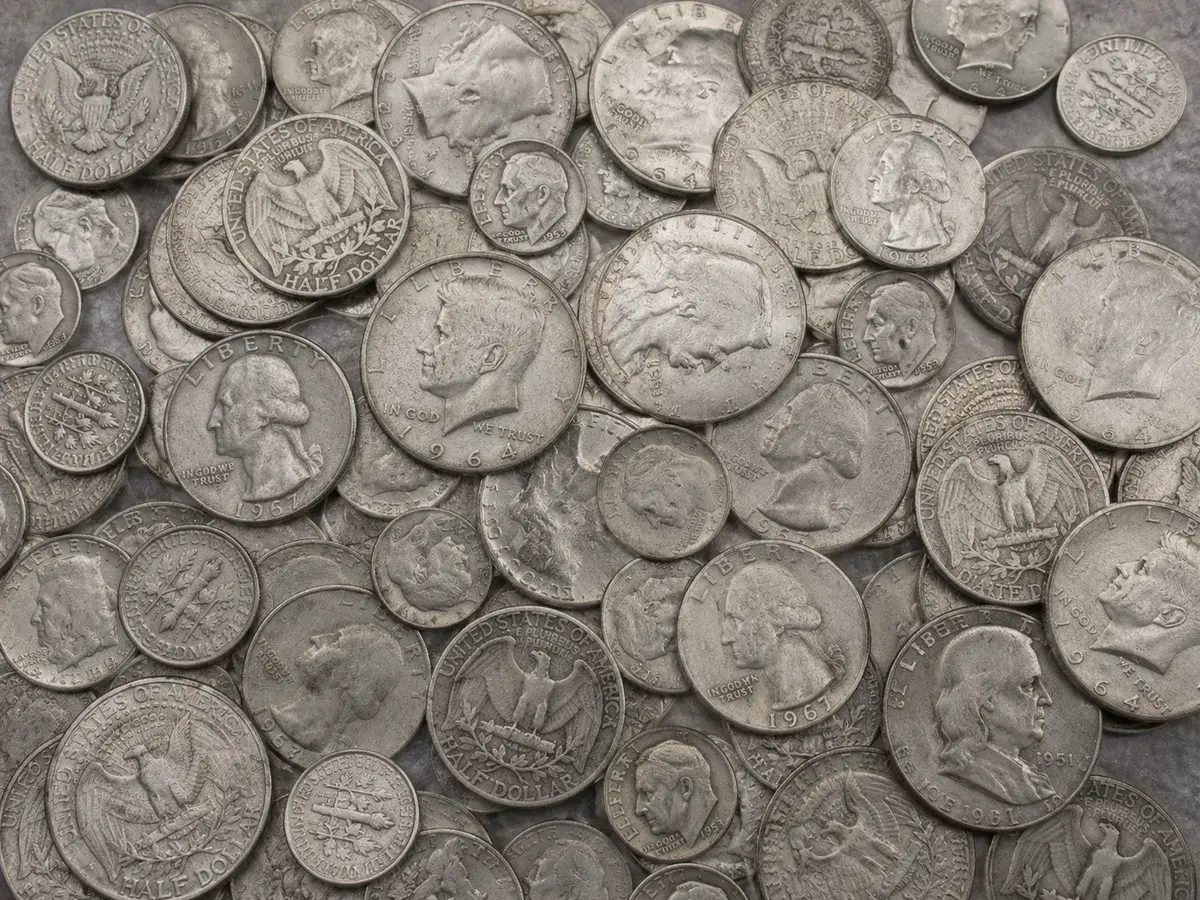 A pile of 90 percent silver US dimes, quarters and half dollars