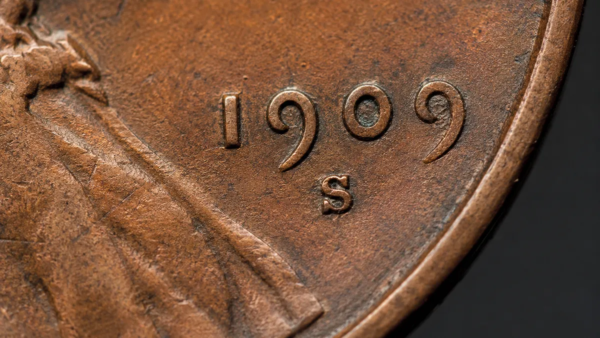 Close-up of a U.S. coin showing its date and mint mark